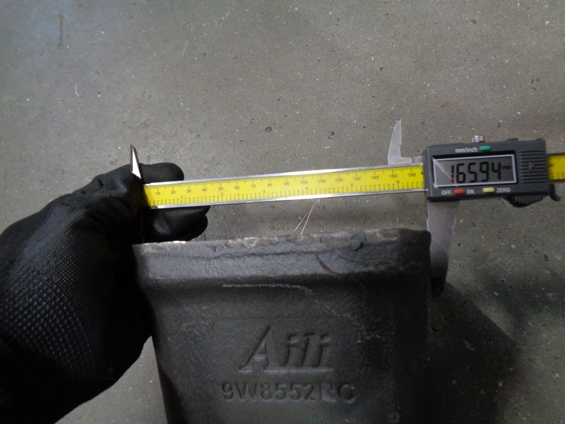 Зуб ковша CDM6490
